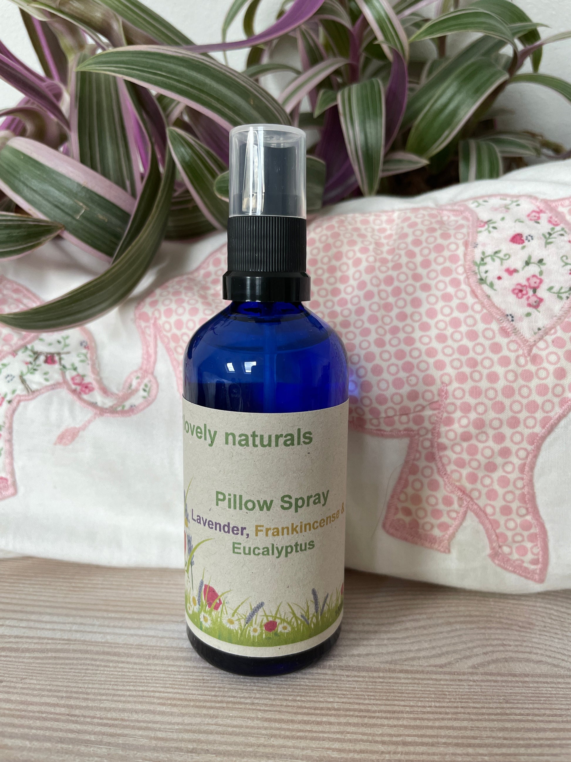 Environmentally friendly handmade Lavender, Eucalyptus & Frankincense Pillow Spray in a blue spray bottle.