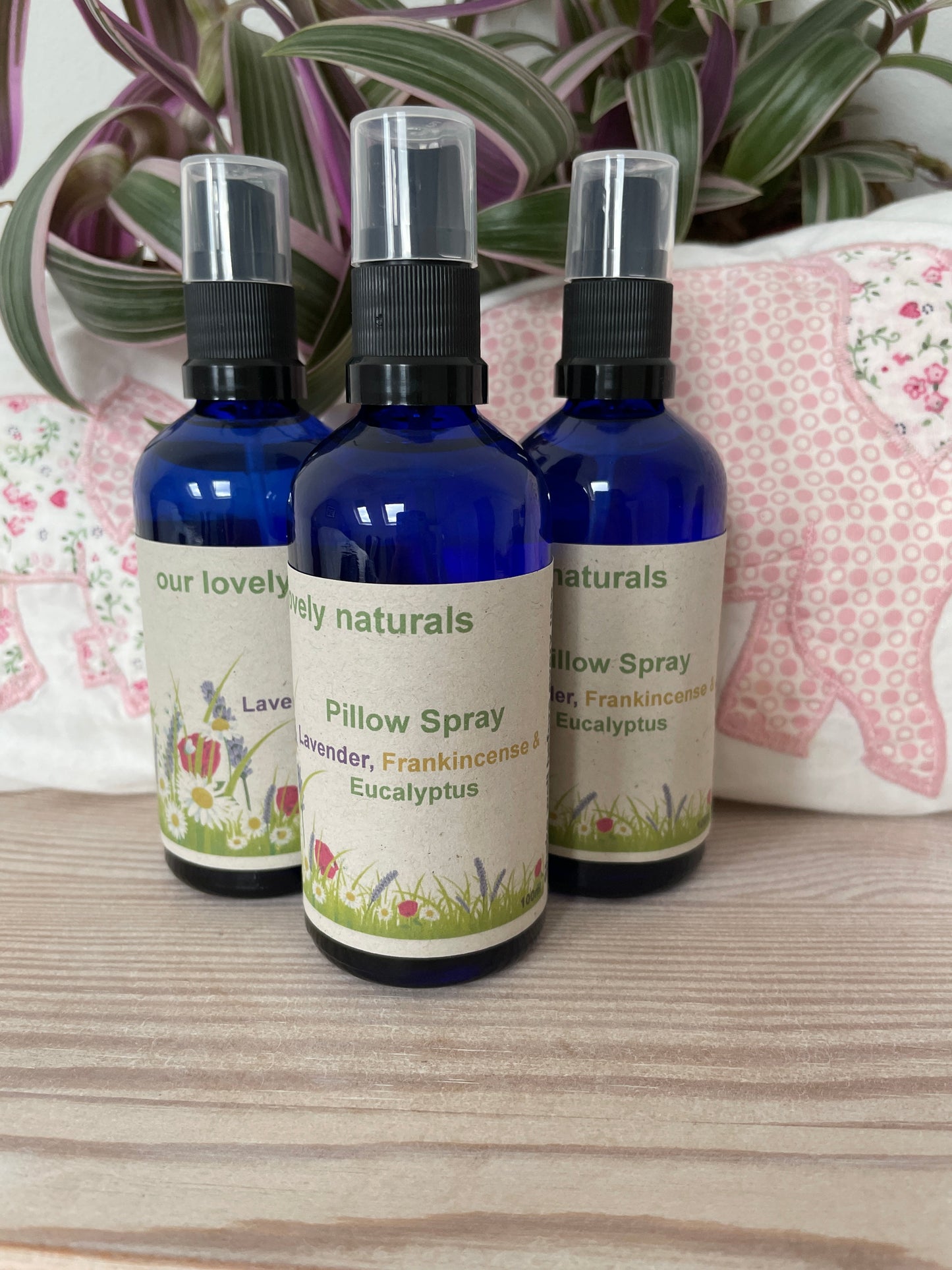 Three bottles of environmentally friendly handmade Lavender, Eucalyptus & Frankincense Pillow Spray in blue spray bottles.